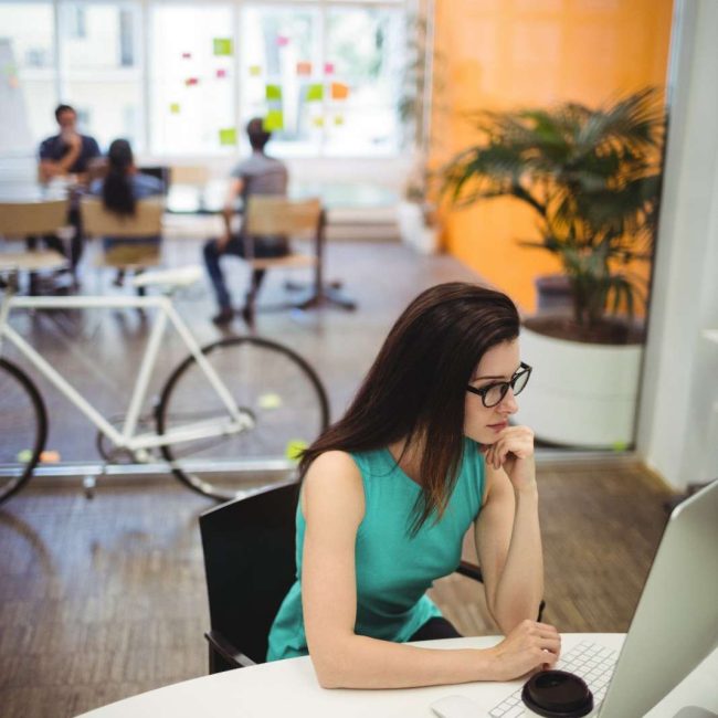 beautiful-female-executive-working-her-desk (1)